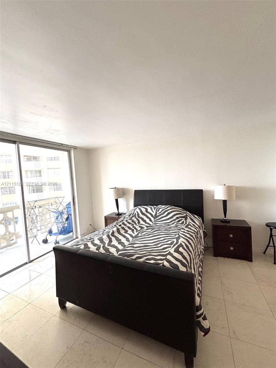 1817 S Ocean Drive, #426, Hallandale Beach, FL 33009 Large-format tile flooring and full-height sliding glass door