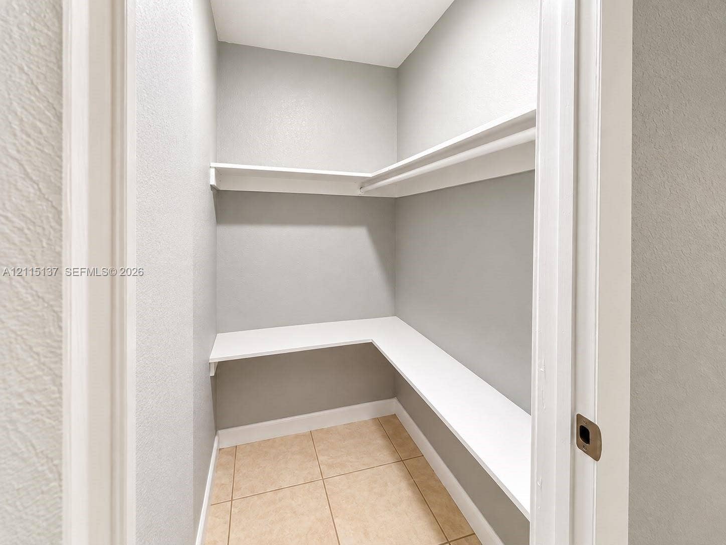7870 SW 10th Court, #A, North Lauderdale, North Lauderdale, FL 33068 Storage area featuring multi-level wrap-around shelving and neutral tile flooring