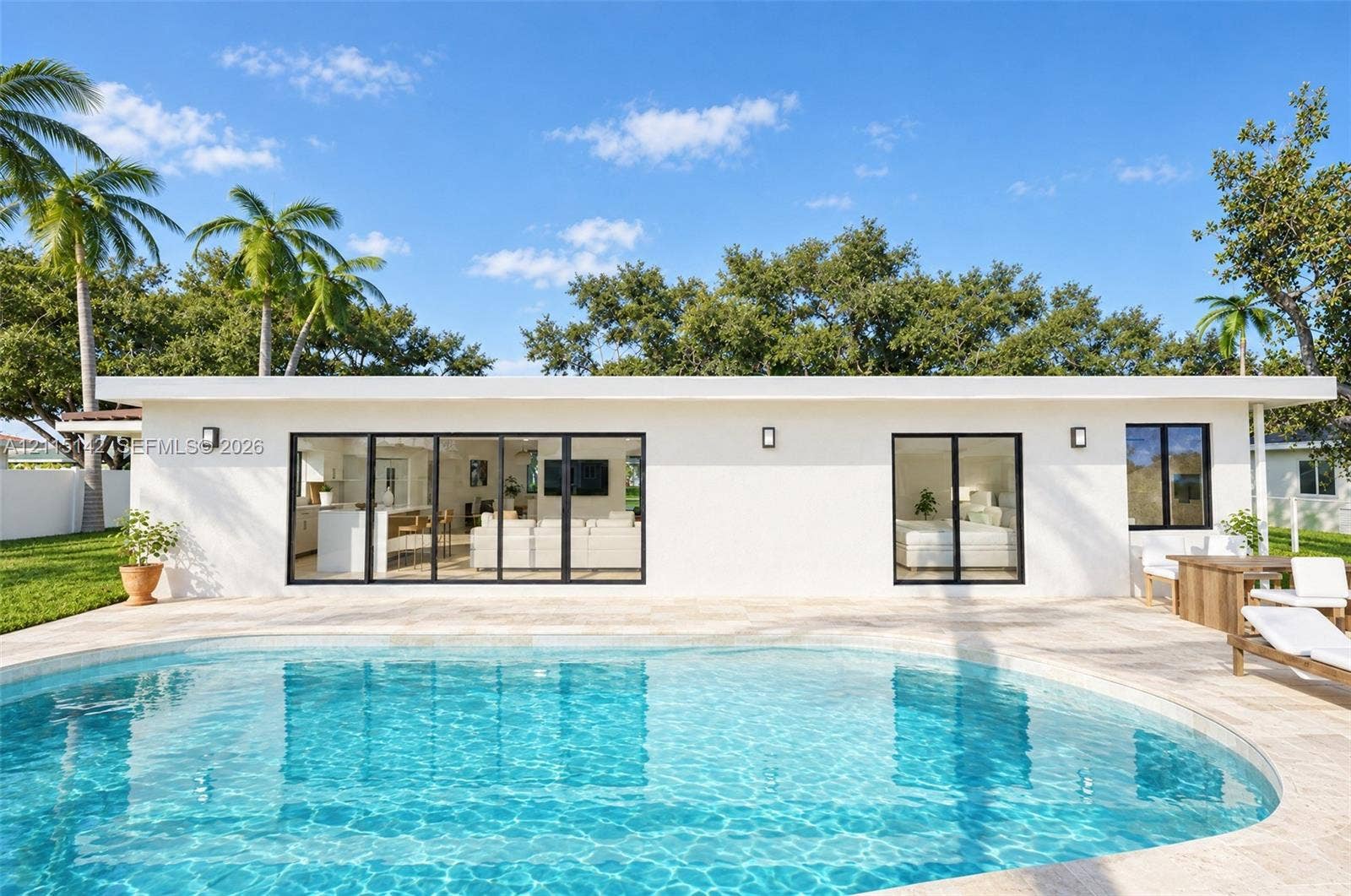 5940 SW 18th Street, Plantation, FL 33317 VIRTUAL RENDERING, NOT AN ACTUAL PHOTO. HOME IS UNDER CONSTRUCTION. Rear exterior and free-form pool shown as proposed per permitted plans; final construction, finishes, landscaping and furnishings may differ. Buyer to verify with developer.