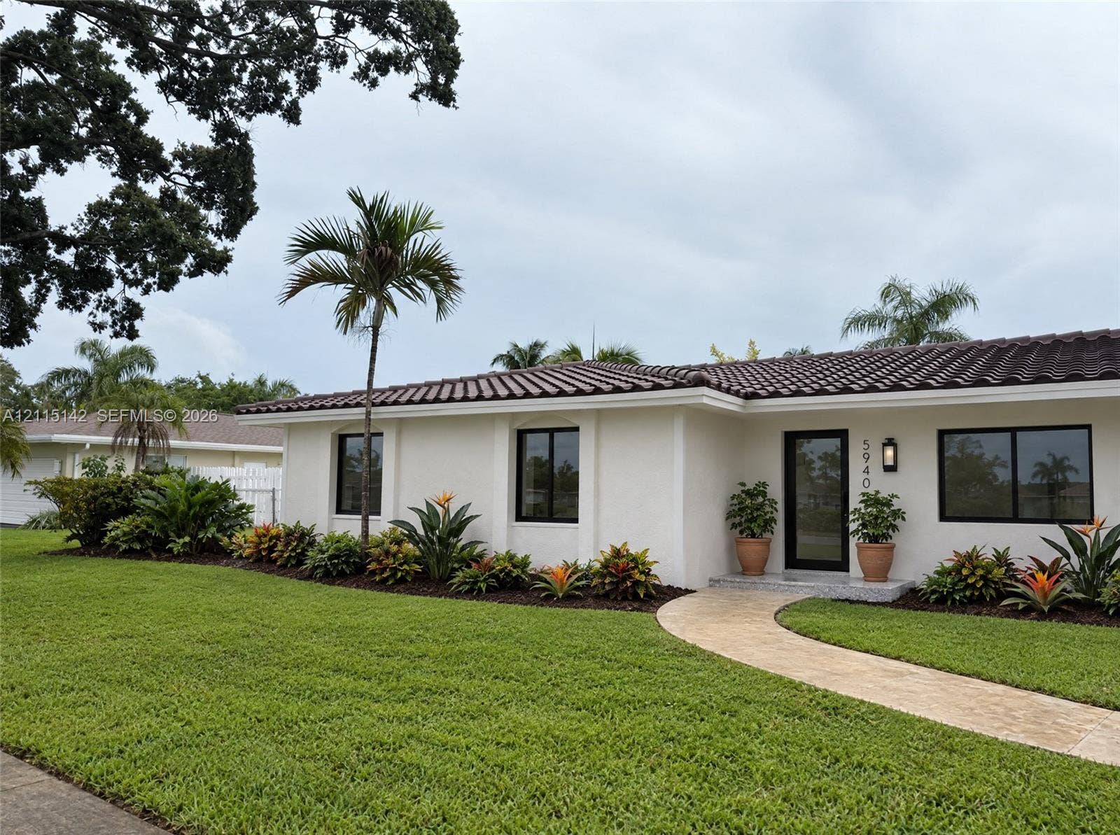 5940 SW 18th Street, Plantation, FL 33317 VIRTUAL RENDERING, NOT AN ACTUAL PHOTO. HOME IS UNDER CONSTRUCTION. Front exterior and lawn shown as proposed per permitted plans; final construction, finishes, landscaping and furnishings may differ. Buyer to verify with developer.