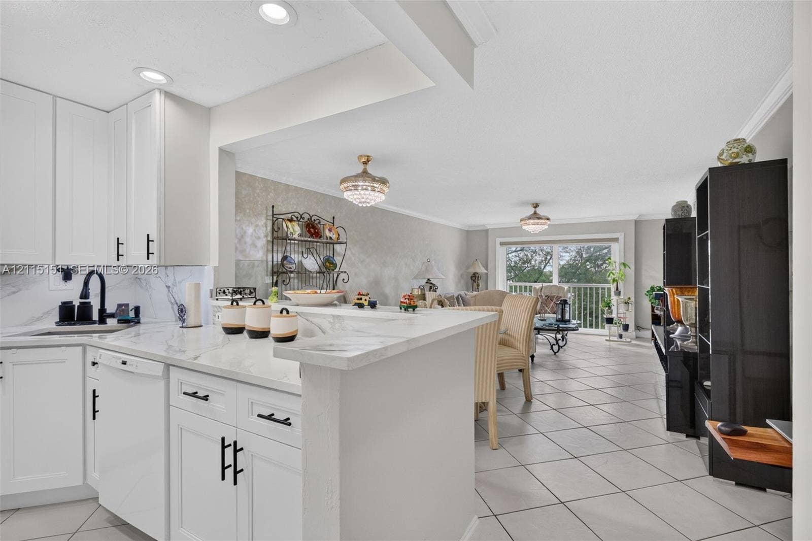 5951 NE 14th Lane, #408N, Fort Lauderdale, FL 33334 Kitchen featuring white shaker-style cabinetry, stone-surface countertops, a matte black faucet, recessed lighting, and tile flooring