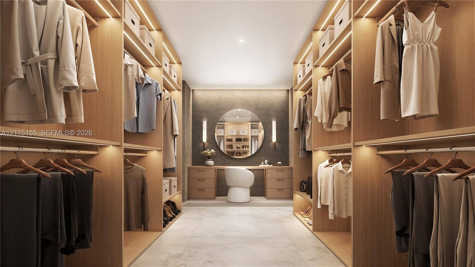 3721 S Le Jeune Road, Miami, FL 33146 Walk-in closet featuring custom wood-finish cabinetry, integrated linear LED shelf lighting, a built-in vanity station, a circular wall-mounted mirror, and tile flooring