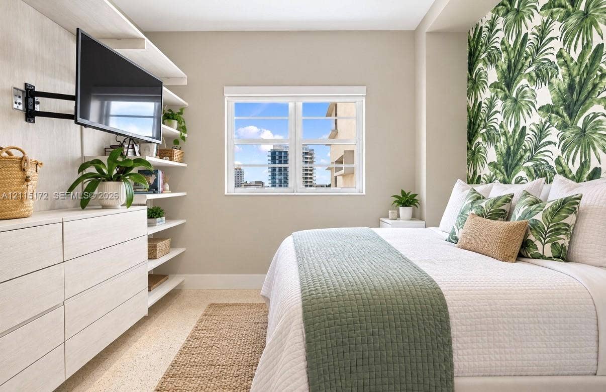 16 Island Avenue, #5C, Miami Beach, FL 33139 Built-in shelving unit, cabinetry with light wood-finish, and window with exterior cityscape