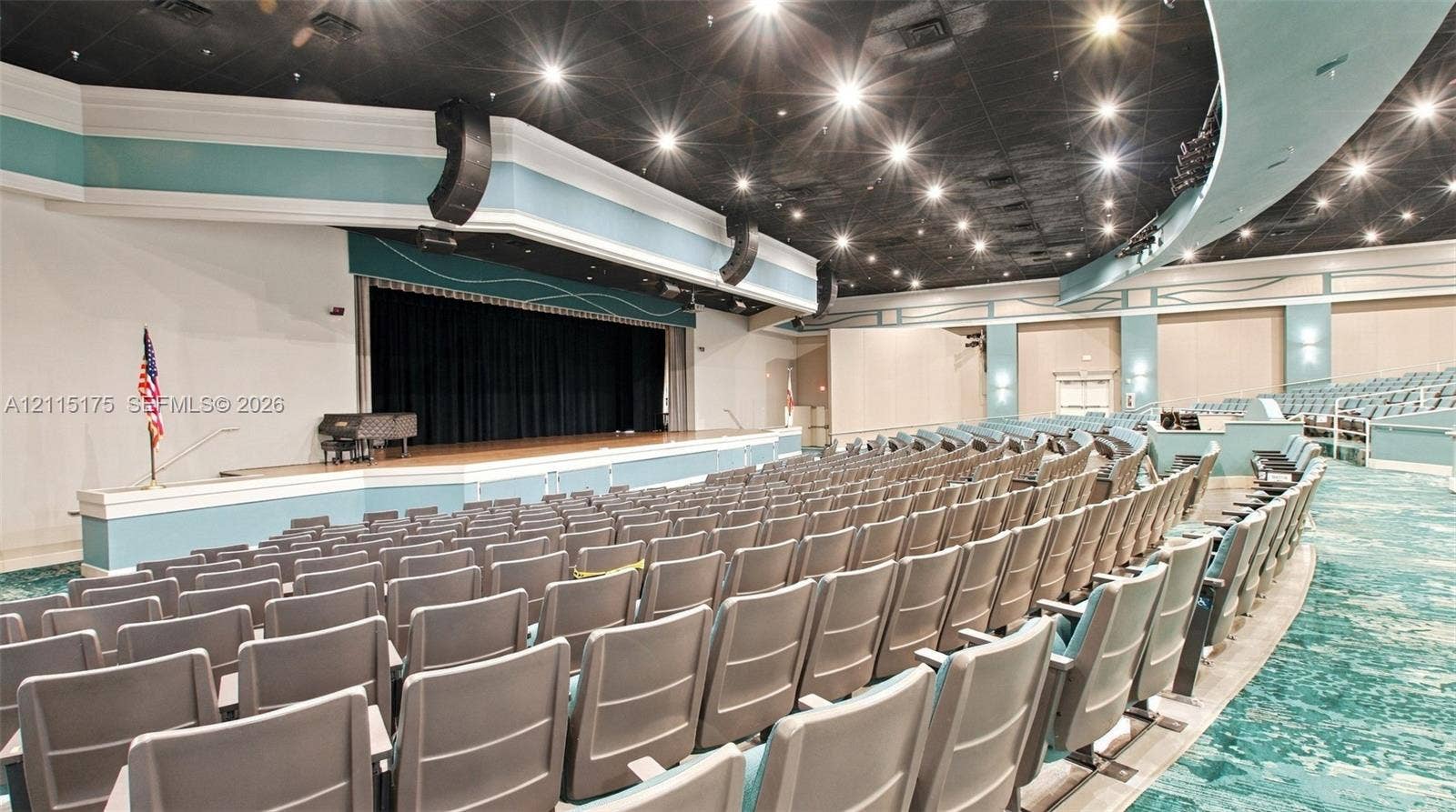 324 Seville N, Delray Beach, FL 33446 Large theater with stadium fixed tiered seating for live shows and movies