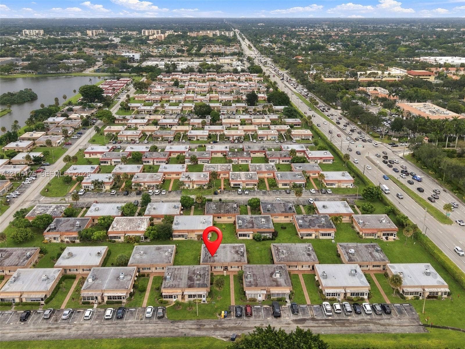 324 Seville N, Delray Beach, FL 33446 Aerial perspective of much of the Seville section with a red pin over the unit