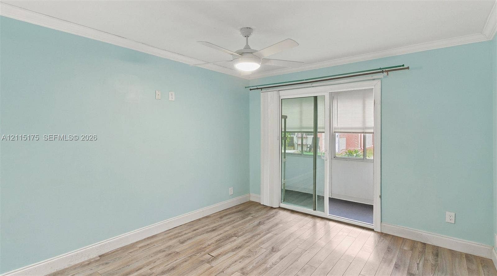 324 Seville N, Delray Beach, FL 33446 Primary bedroom with its own glass sliding doors leading to lanai.