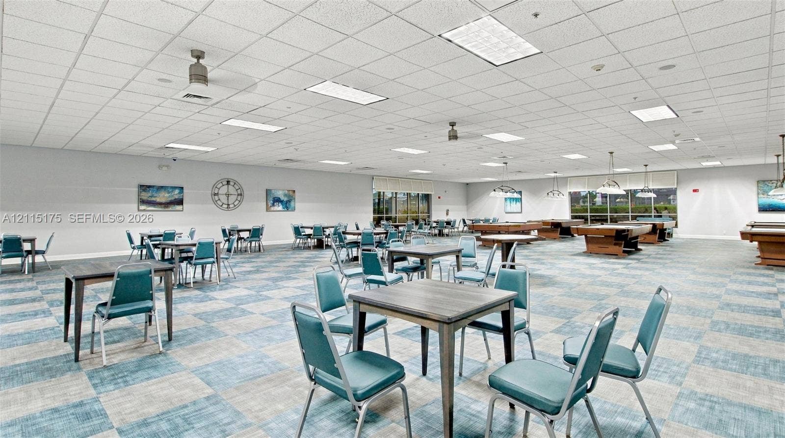 324 Seville N, Delray Beach, FL 33446 Expansive open-concept recreation room in one of the satellite clubhouses featuring multiple card tables and billiard tables, a drop ceiling with recessed lighting and integrated ceiling fans