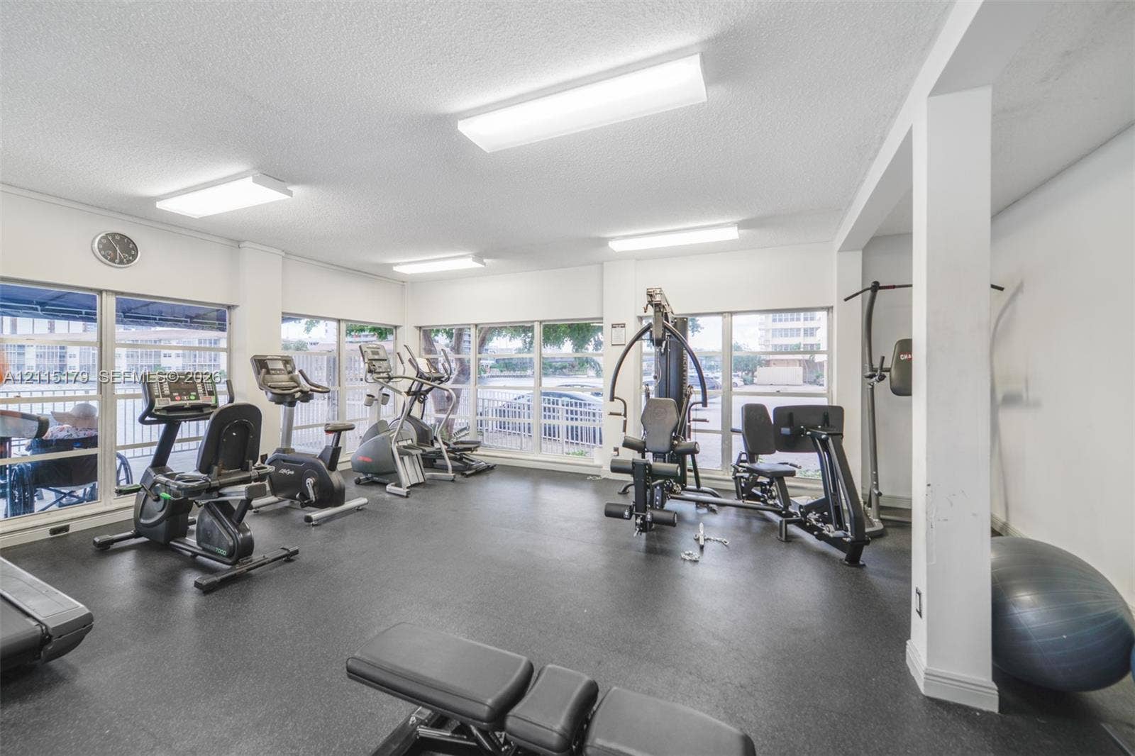 1849 S Ocean Drive, #407, Hallandale Beach, Hallandale Beach, FL 33009 Fitness room featuring rubberized flooring, expansive windows, and overhead fluorescent lighting
