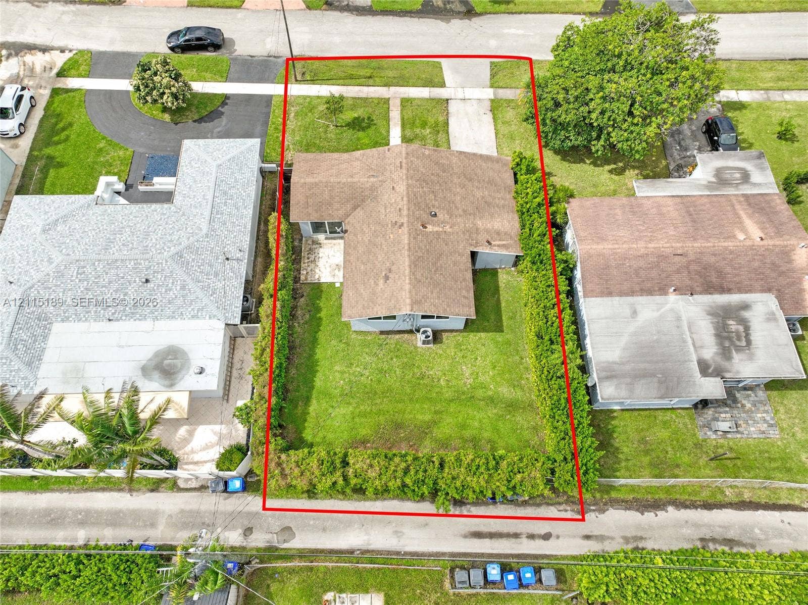 2111 N 14th Court, Hollywood, Hollywood, FL 33020 Aerial perspective of property featuring an expansive backyard, mature hedge perimeter, concrete patio, and dedicated driveway
