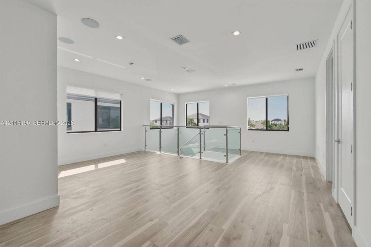 Upstairs loft and glass railing.