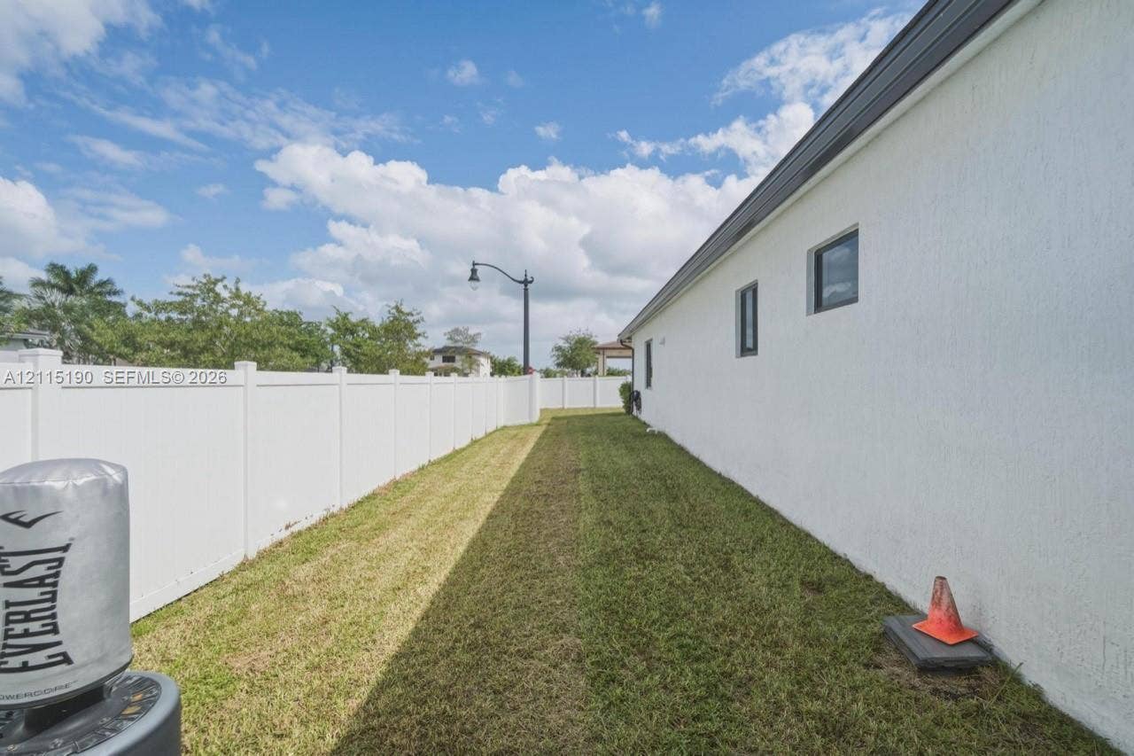 Fenced side yard.