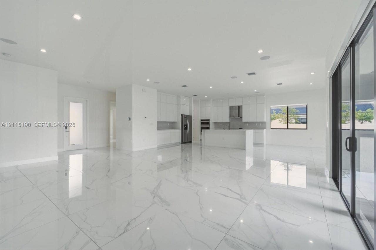 Open living area with kitchen view.