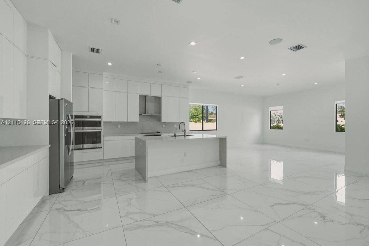 Kitchen island and surrounding cabinetry.