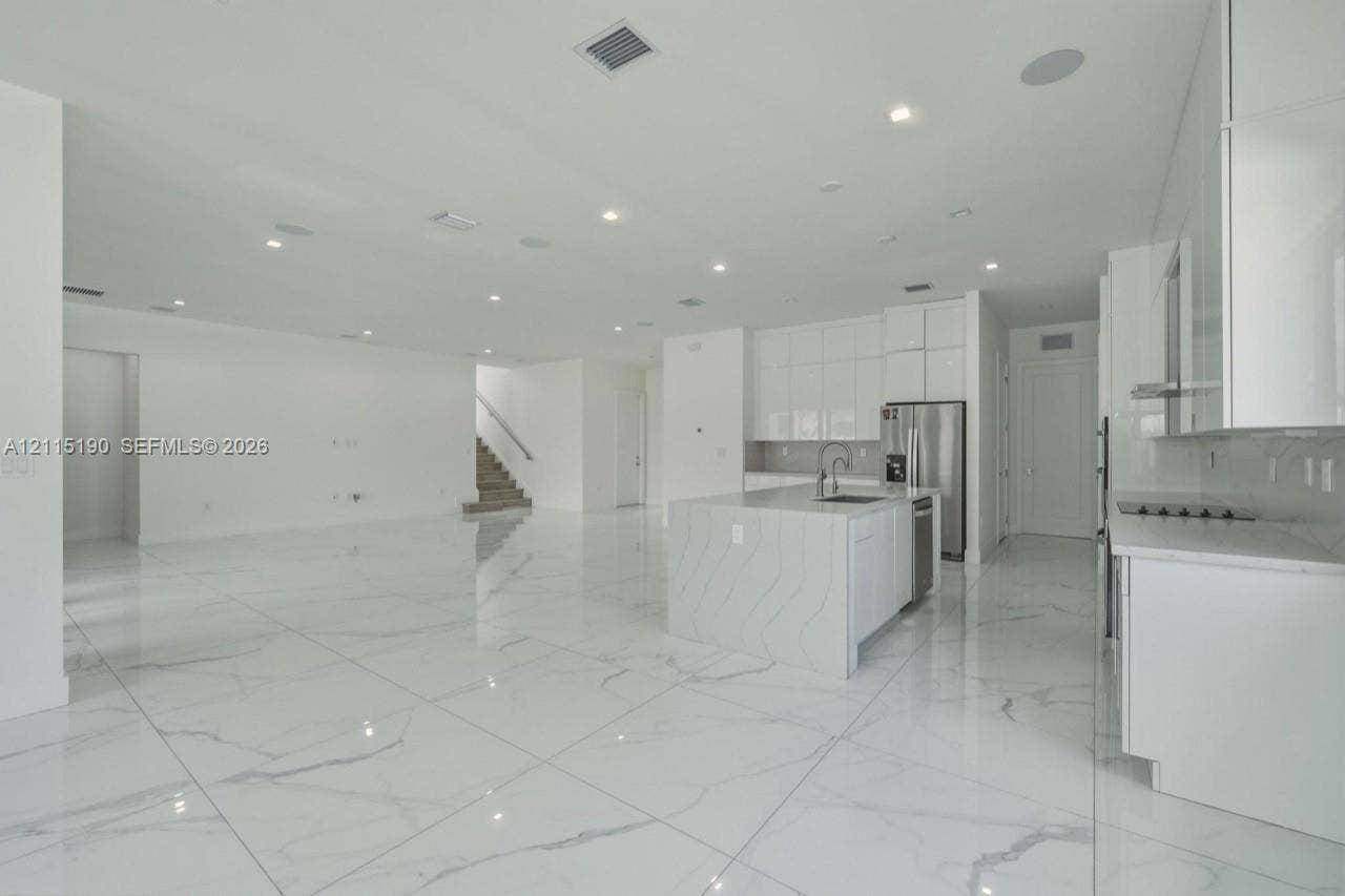Island kitchen overlooking the living area.