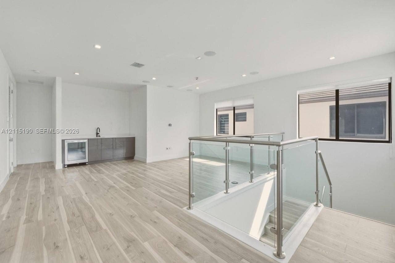 Upstairs loft with wet bar and beverage refrigerator.