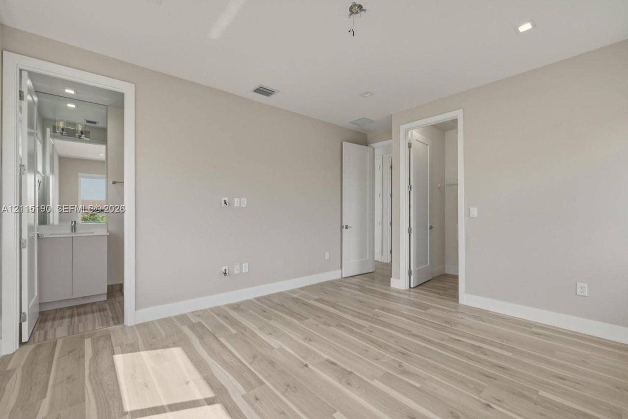 Bedroom with adjoining bathroom and closet.