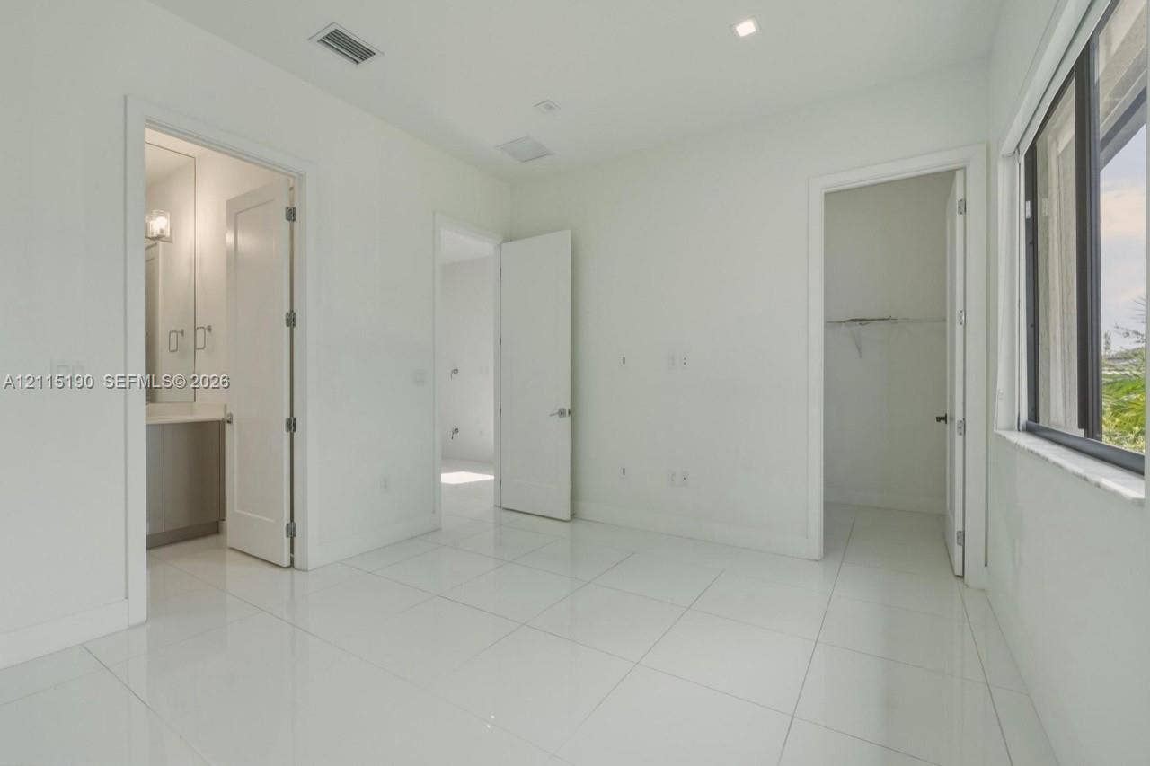Bedroom and adjoining bathroom.