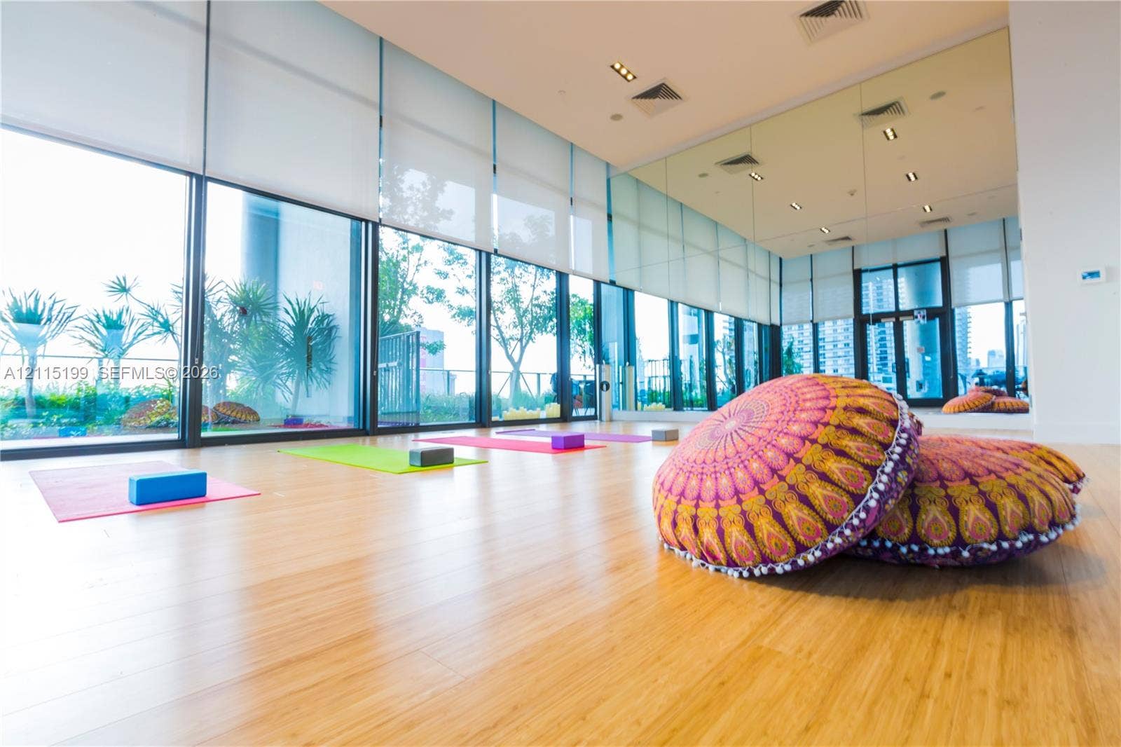 1600 NE 1st Avenue, #3120, Miami, FL 33132 Floor-to-ceiling windows, wood-finish flooring, full-wall mirrors, recessed lighting, and retractable window shades