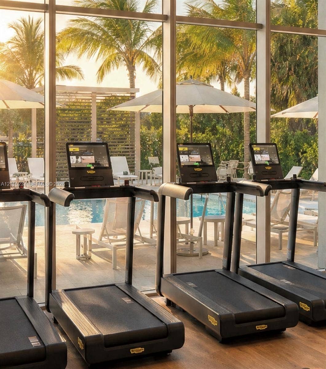 2411 Laguna Circle, #802, North Miami, North Miami, FL 33181 Fitness center featuring floor-to-ceiling windows and wood-finish flooring