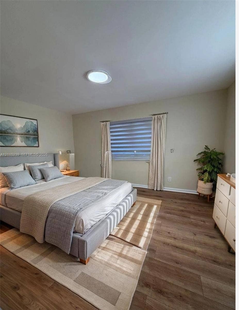 9015 SW 138th Street, #16-2, Miami, Miami, FL 33176 Neutral-toned interior featuring wood-finish flooring, a flush-mount ceiling light fixture, and horizontal-slat window treatments