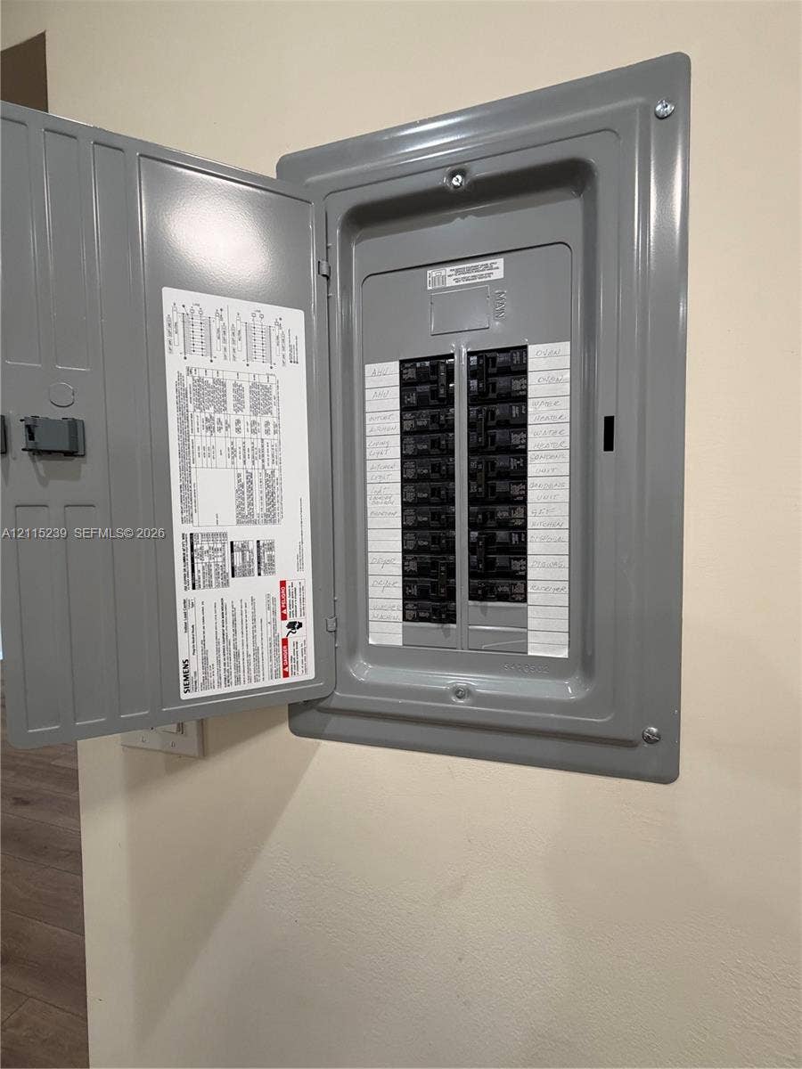 9015 SW 138th Street, #16-2, Miami, Miami, FL 33176 Siemens electrical service panel featuring a recessed metal enclosure, hinged door, and multiple circuit breakers