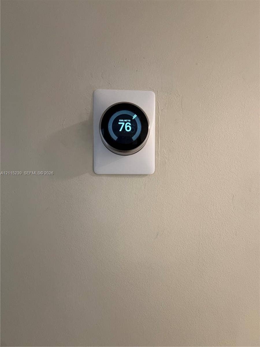 9015 SW 138th Street, #16-2, Miami, Miami, FL 33176 Wall-mounted digital smart thermostat featuring a circular display interface