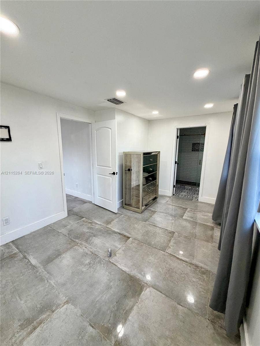 8047 NW 1st Place, Miami, Miami, FL 33150 Large-format stone-style tile flooring, recessed ceiling lighting, and solid-core interior doors