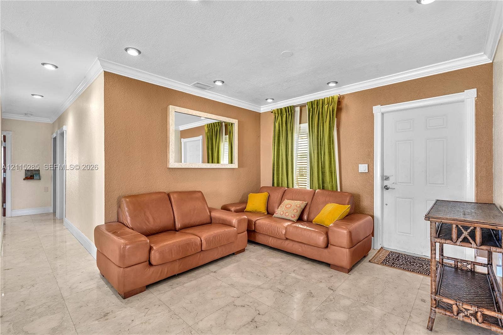 14221 Carver Drive, Miami, FL 33176 Interior space featuring polished stone-finish tile flooring, recessed ceiling lighting, crown molding, and a wall-mounted mirror with a light-tone frame