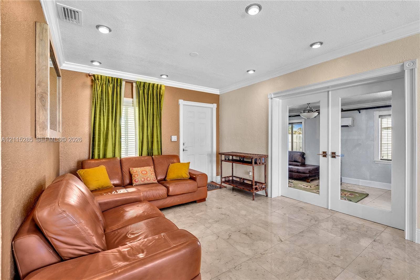 14221 Carver Drive, Miami, FL 33176 Polished stone tile flooring, recessed lighting, crown molding, and white-framed French doors with glass panels