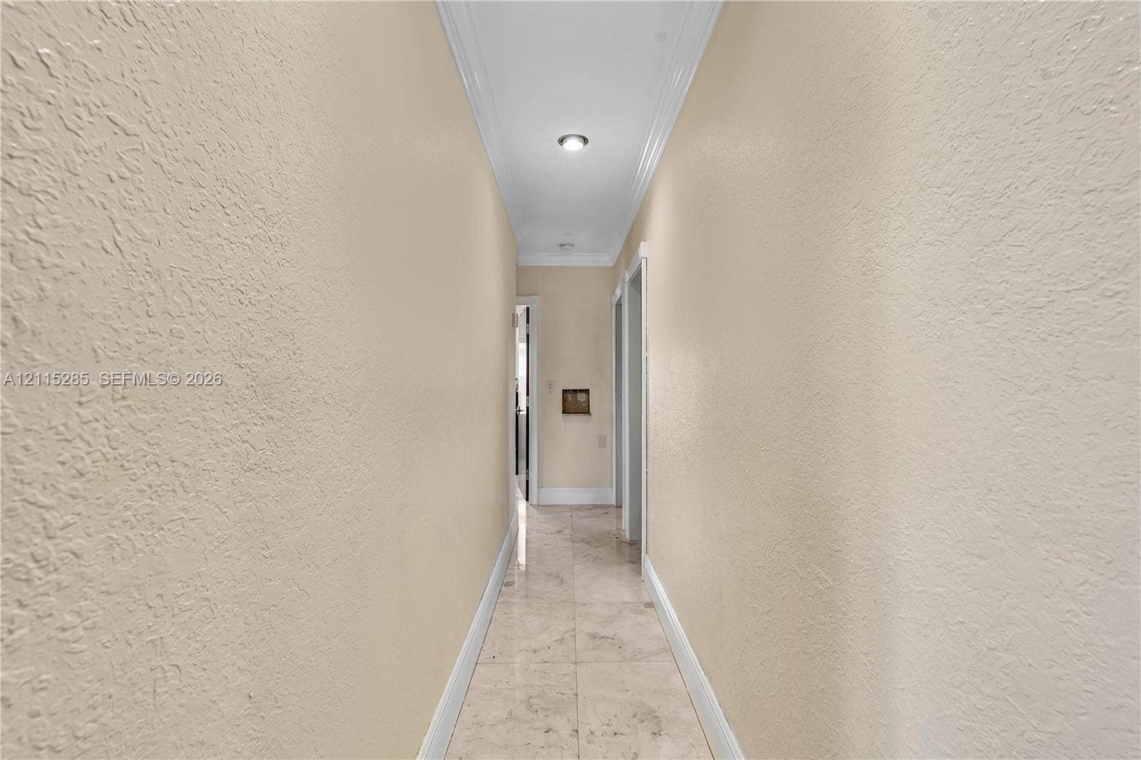 14221 Carver Drive, Miami, FL 33176 Hallway featuring neutral-toned wall paint, crown molding, recessed ceiling lighting, and tile flooring