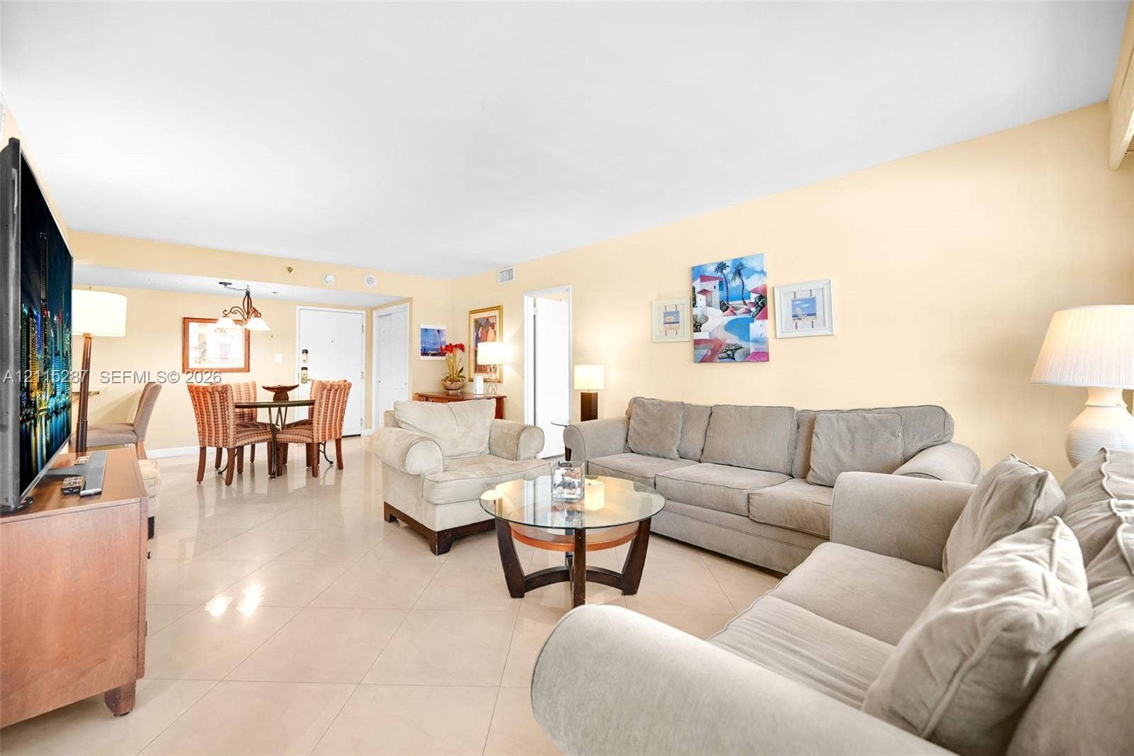 5225 Collins Avenue, #511, Miami Beach, FL 33140 Open-concept interior featuring large-format tile flooring and recessed lighting