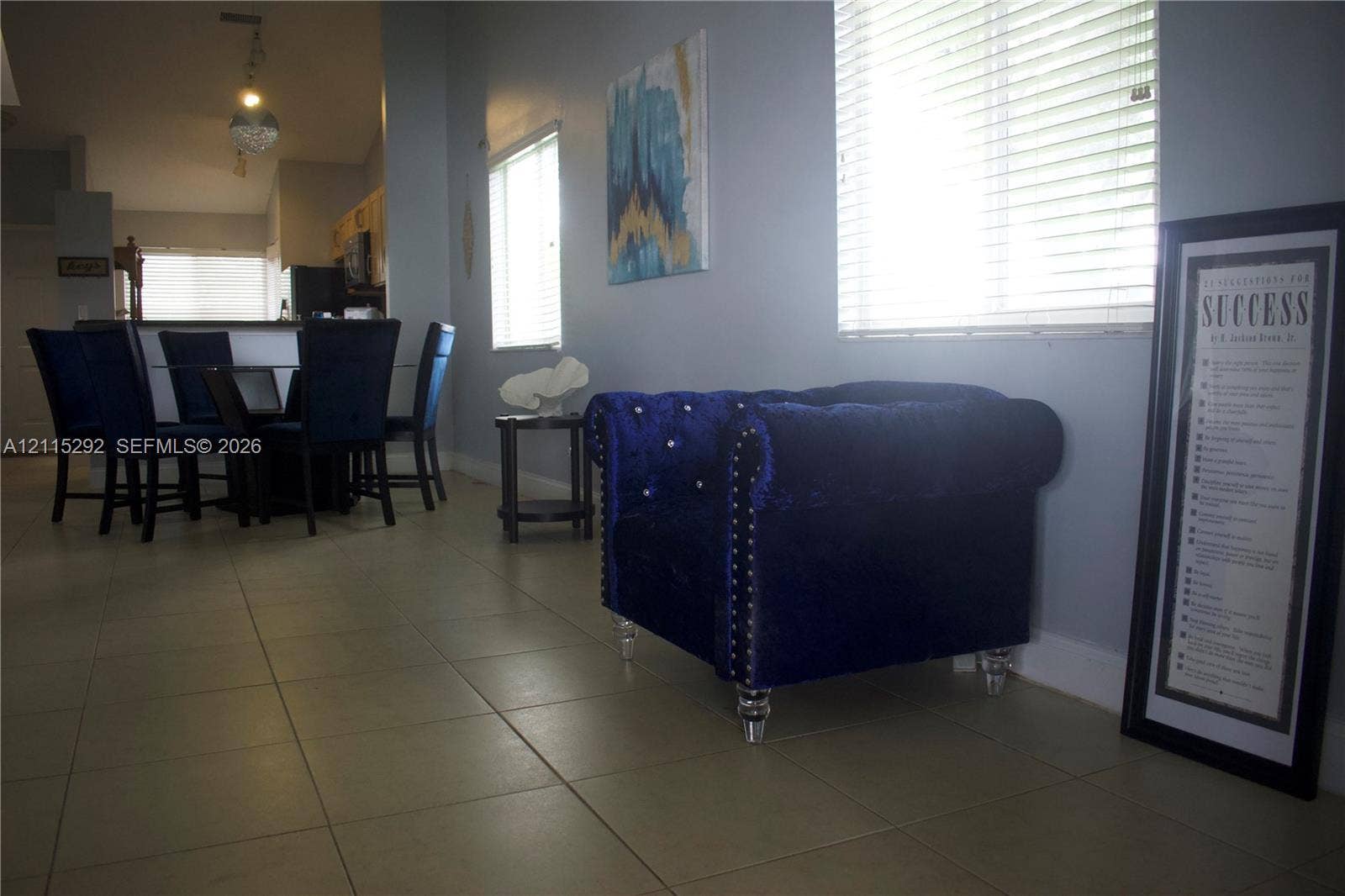 2700 SW 55th Street, #1, Dania, Dania Beach, FL 33312 Interior space featuring large-format floor tile, vaulted ceilings, and horizontal window blinds