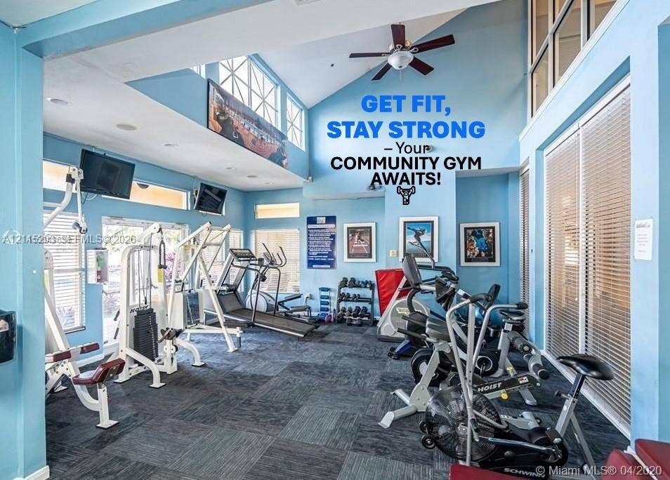 2642 NW 33rd Street, #1902, Oakland Park, Oakland Park, FL 33309 Fitness center featuring vaulted ceilings, oversized windows, and neutral carpeting