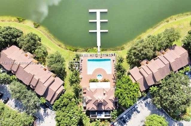 2642 NW 33rd Street, #1902, Oakland Park, Oakland Park, FL 33309 Waterfront property featuring a private multi-slip dock, a swimming pool, a separate spa, and paved grounds