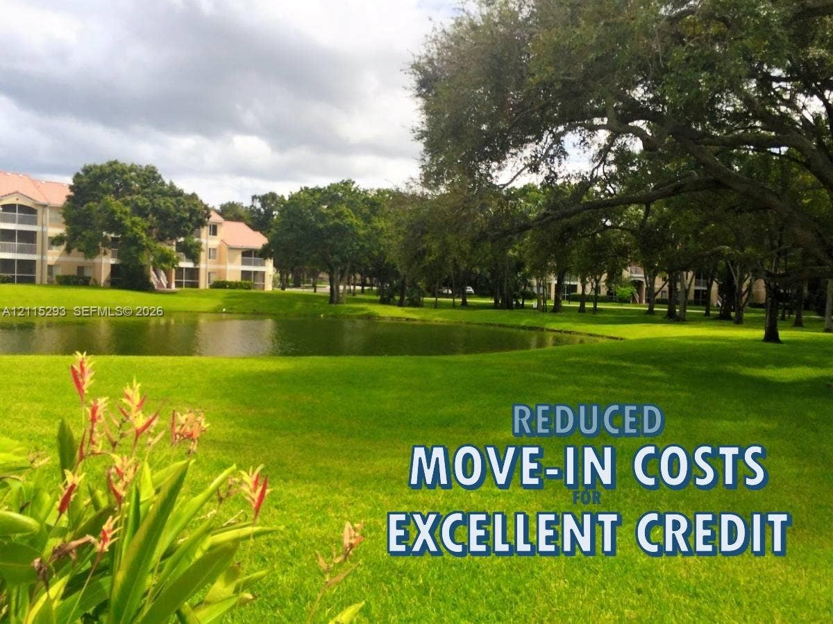2642 NW 33rd Street, #1902, Oakland Park, Oakland Park, FL 33309 Expansive manicured grounds featuring a natural pond, mature shade trees, and tiered residential architecture