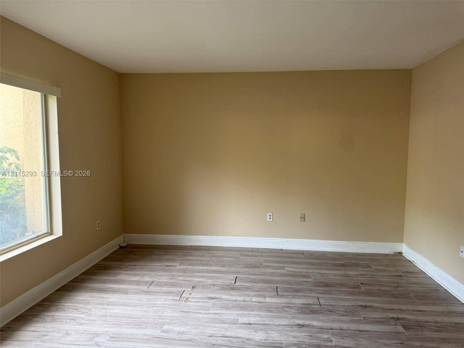 2642 NW 33rd Street, #1902, Oakland Park, Oakland Park, FL 33309 Interior room featuring wood-finish tile flooring and a large window
