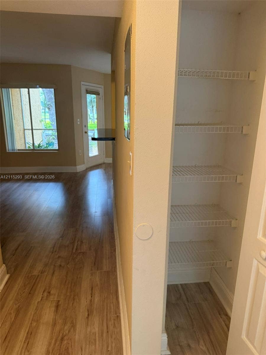 2642 NW 33rd Street, #1902, Oakland Park, Oakland Park, FL 33309 Built-in storage closet with wire shelving and wood-finish flooring