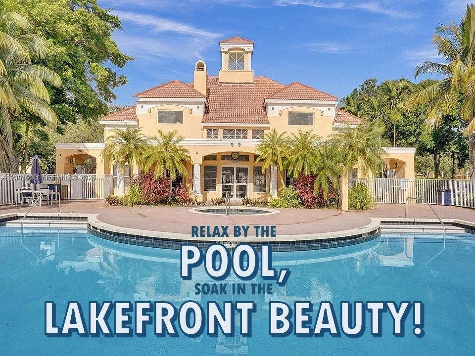 2642 NW 33rd Street, #1902, Oakland Park, Oakland Park, FL 33309 Stucco exterior featuring a tiled hip roof, architectural cupola, covered veranda, and a concrete deck surrounding an in-ground swimming pool