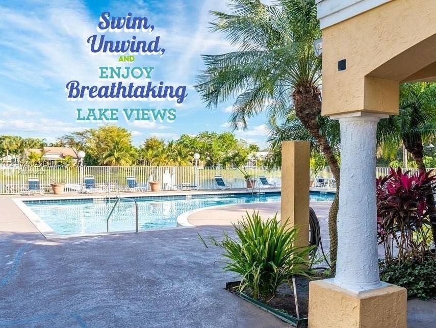 2642 NW 33rd Street, #1902, Oakland Park, Oakland Park, FL 33309 Swimming pool with a concrete deck, white metal fencing, and decorative pillar architectural elements