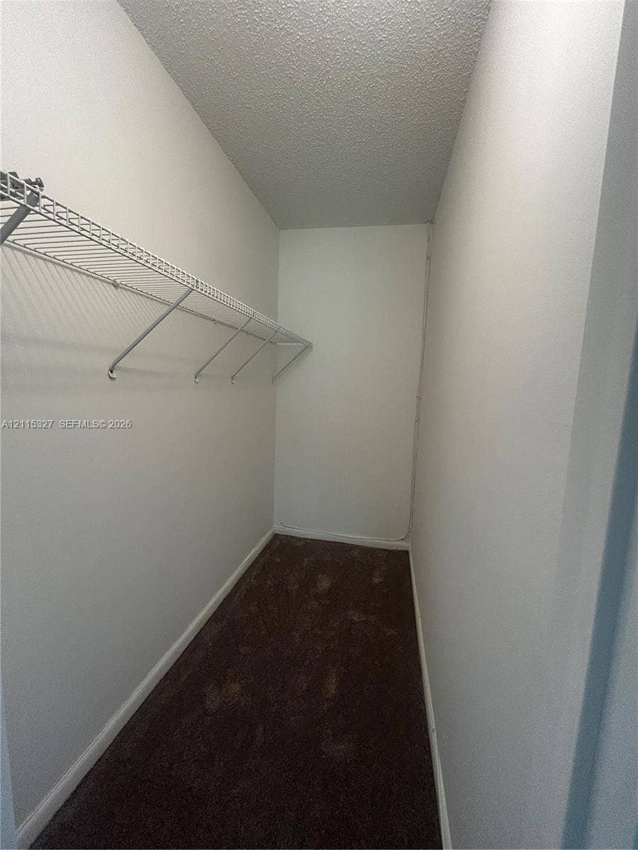 335 Brighton H, #H, Boca Raton, Boca Raton, FL 33434 Storage area featuring wall-to-wall carpeting and wire shelving