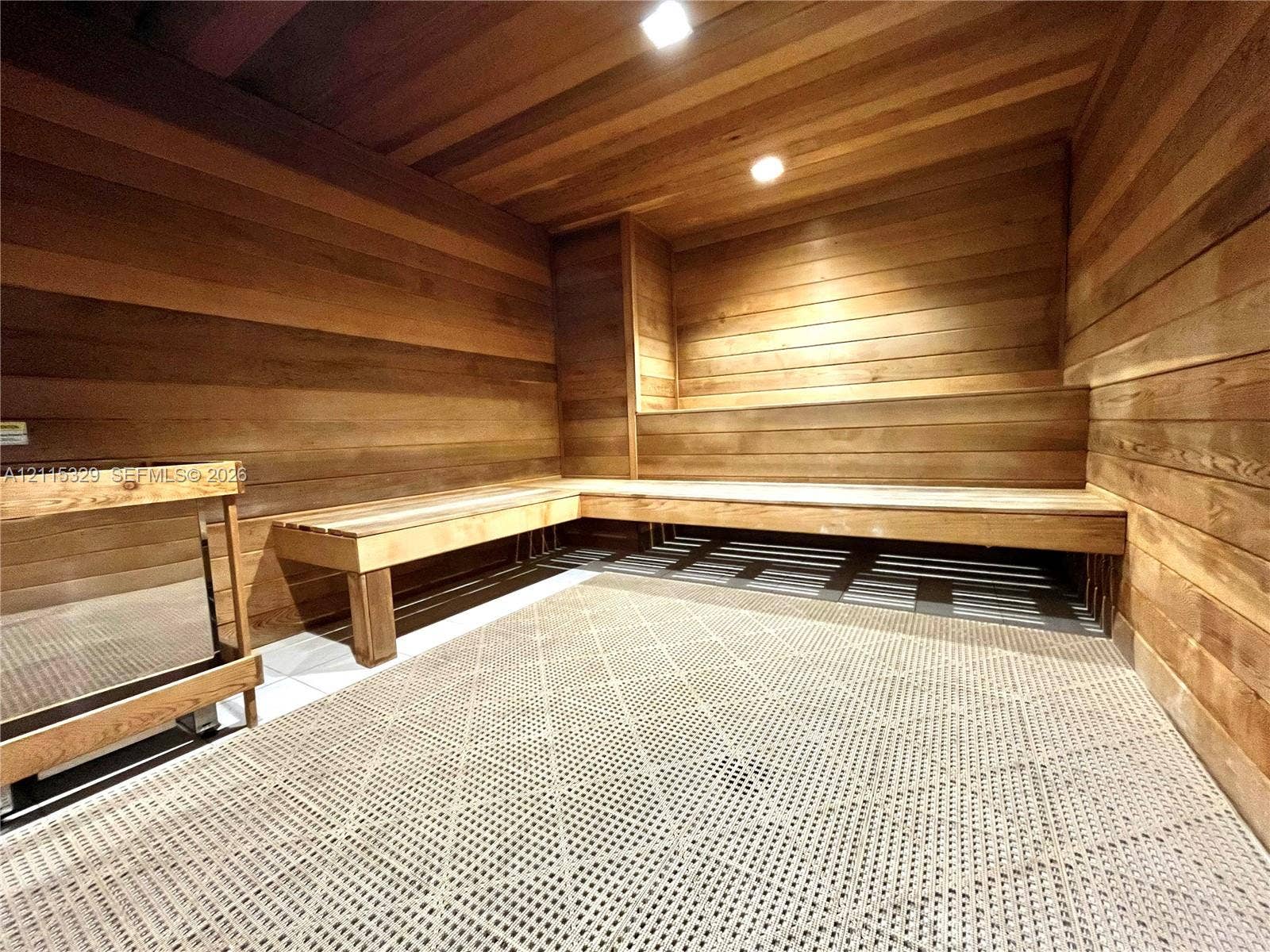2500 Parkview Drive, #1705, Hallandale Beach, Hallandale Beach, FL 33009 Sauna featuring horizontal wood paneling on the walls and ceiling, tiered built-in wood benches, and recessed lighting