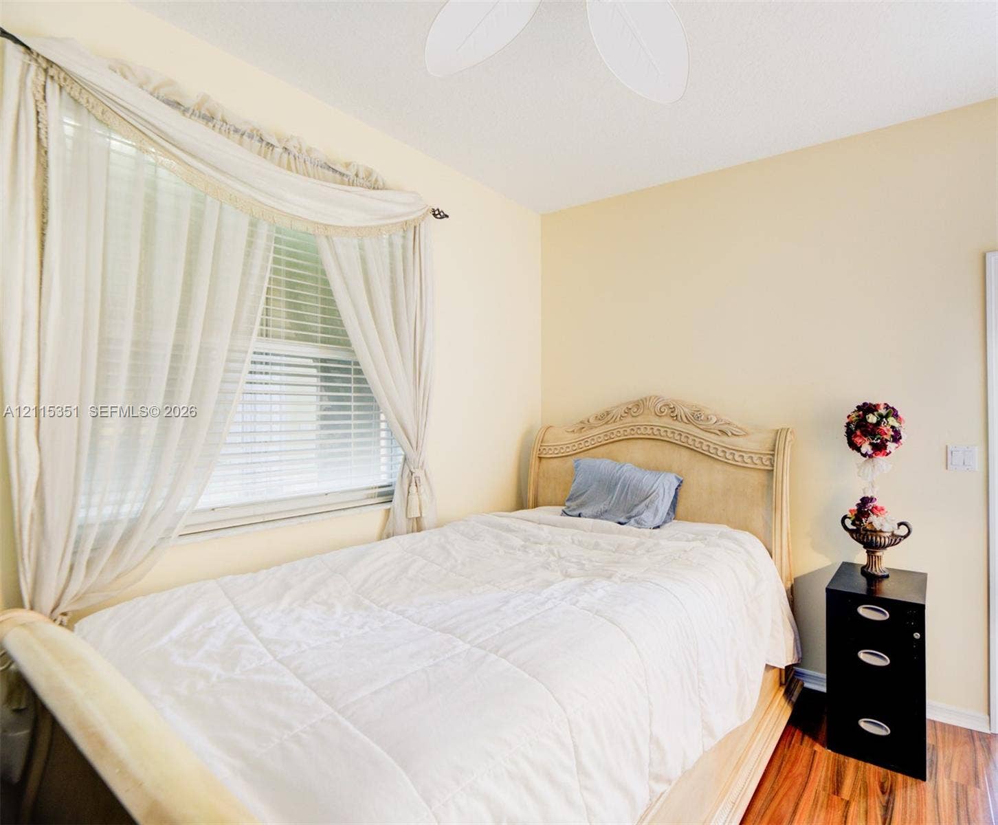 13845 NW 20th Street, Pembroke Pines, FL 33028 Room featuring wood-finish flooring, a ceiling fan, and a window with horizontal blinds