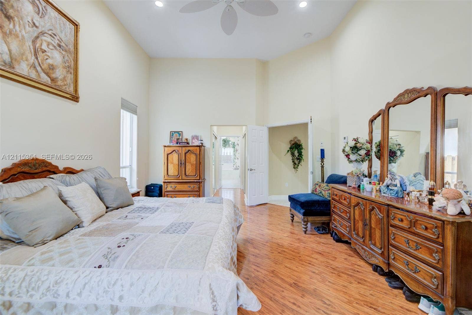 13845 NW 20th Street, Pembroke Pines, FL 33028 High-ceilinged room featuring wood-finish flooring, recessed lighting, a ceiling fan, and tall vertical windows