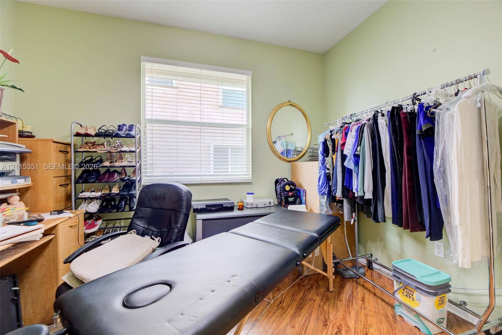 13845 NW 20th Street, Pembroke Pines, FL 33028 Room featuring wood-finish flooring and a central window with horizontal blinds
