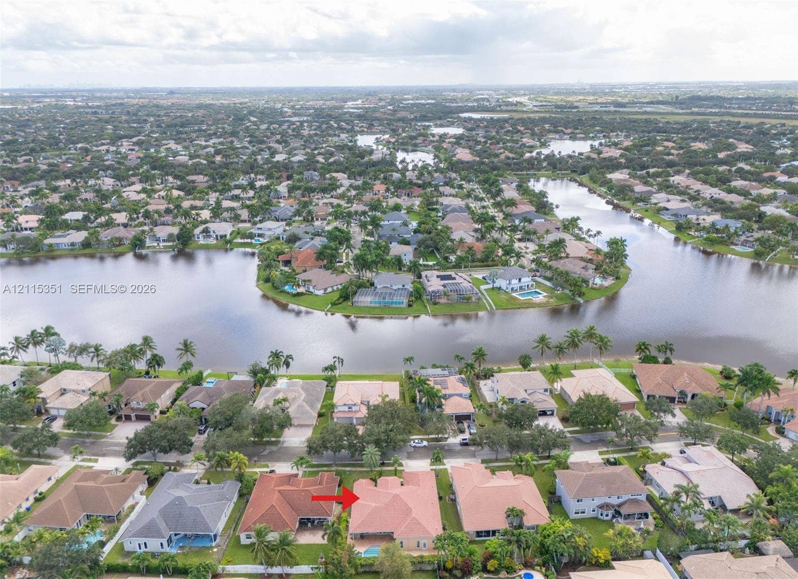 13845 NW 20th Street, Pembroke Pines, FL 33028 Single-story residence featuring a tile roof, screen-enclosed pool, and paver patio