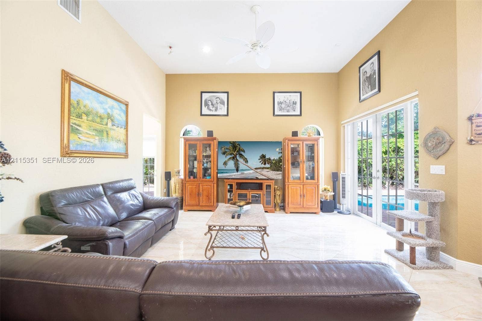 13845 NW 20th Street, Pembroke Pines, FL 33028 Vaulted ceilings, large-format tile flooring, dual arched windows, and multi-pane glass French doors