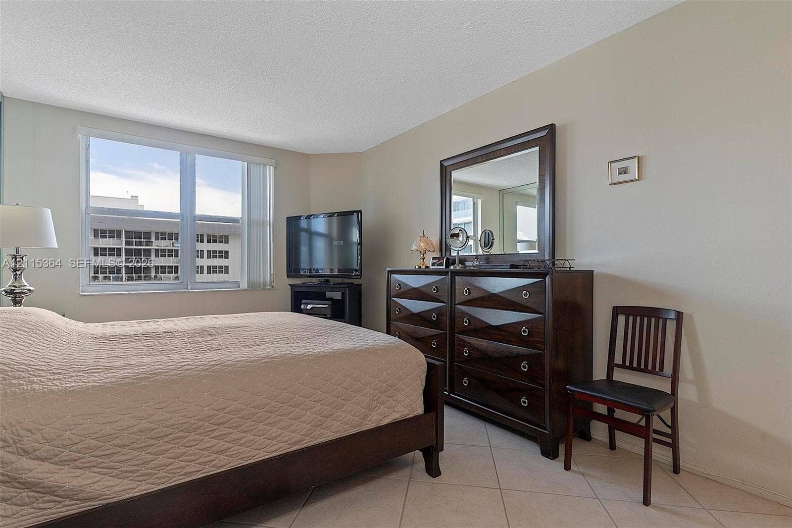 1980 S Ocean Drive, #20A, Hallandale Beach, Hallandale Beach, FL 33009 Neutral-toned walls, large window with natural light, and tile flooring