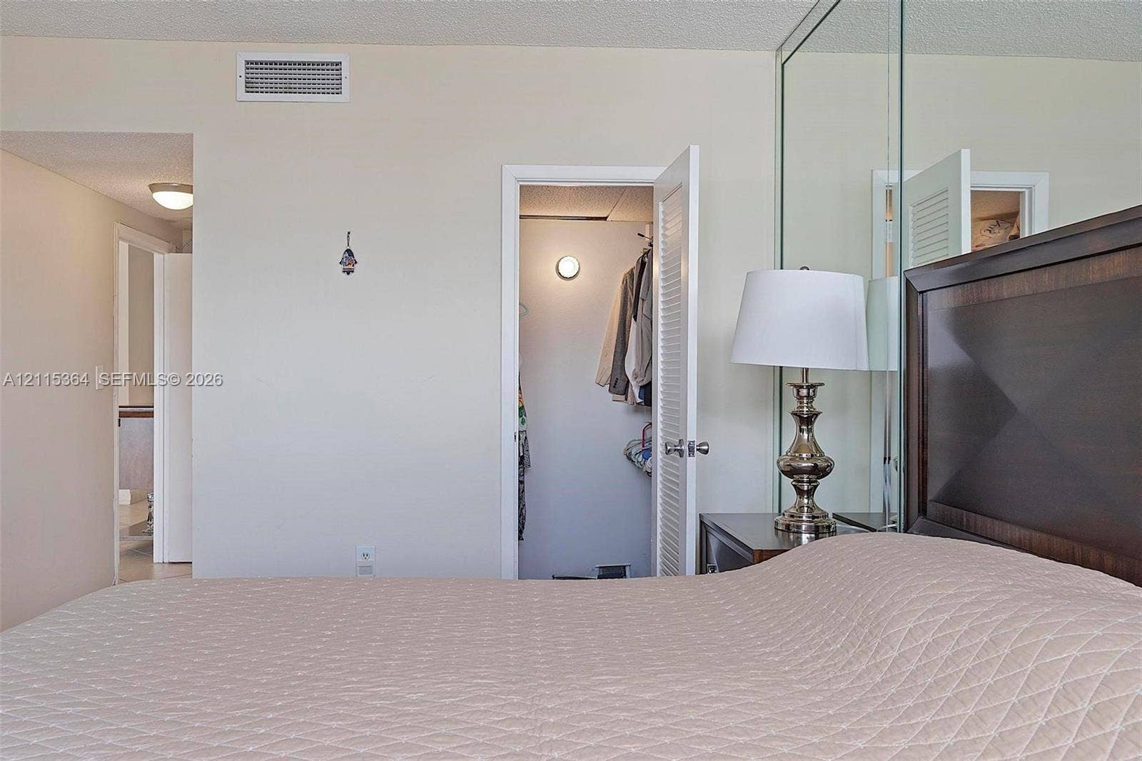 1980 S Ocean Drive, #20A, Hallandale Beach, Hallandale Beach, FL 33009 Full-wall mirrored accent, interior closet with louvered door, and recessed lighting