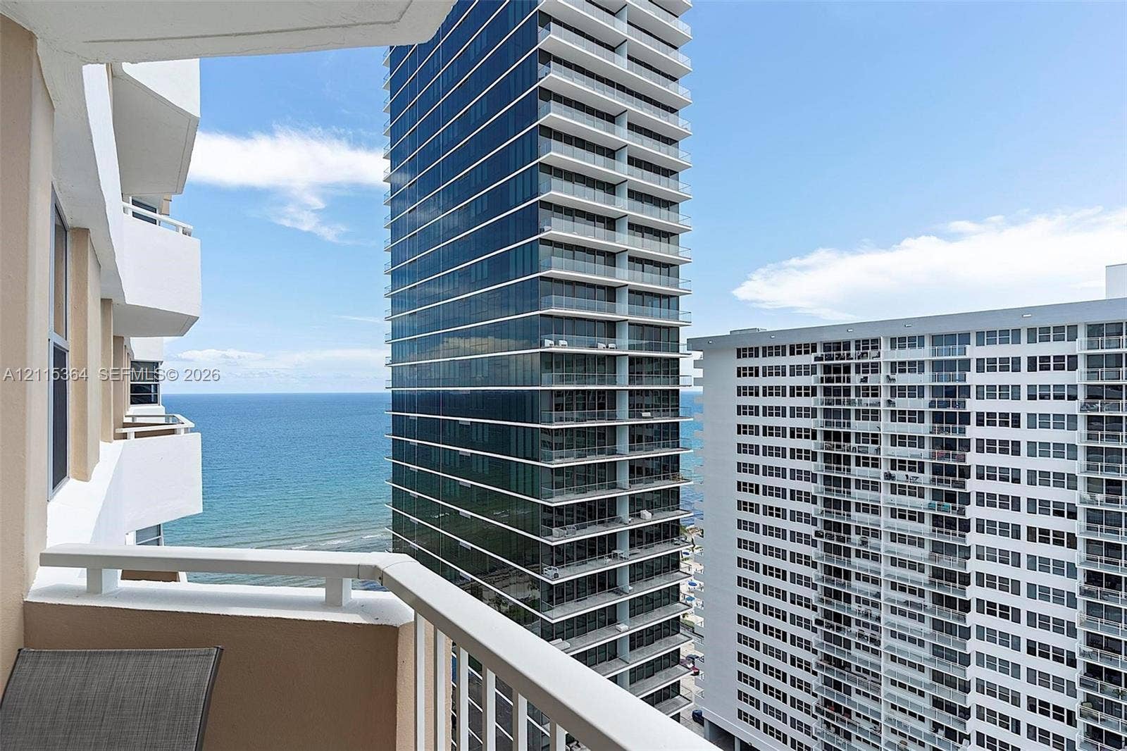 1980 S Ocean Drive, #20A, Hallandale Beach, Hallandale Beach, FL 33009 Private balcony featuring white metal railings and expansive coastal and urban horizon imagery