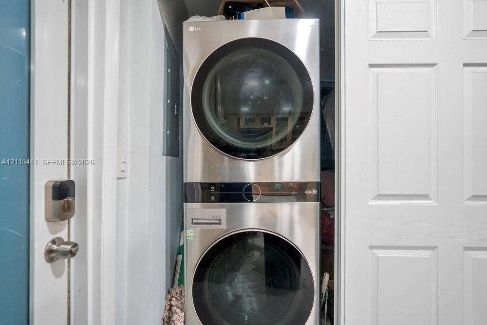20302 NW 39th Court, Miami Gardens, FL 33055 Stacked stainless steel LG laundry unit featuring digital controls and circular glass doors